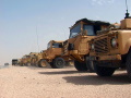 British equipment and vehicles line the road